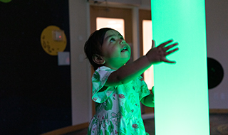 A young customer holds on to the rainbow air tube. It’s a column of light that automatically cycles through 12 colours.