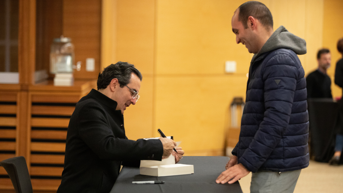 Image of Juan Gabriel Vasquez signing books