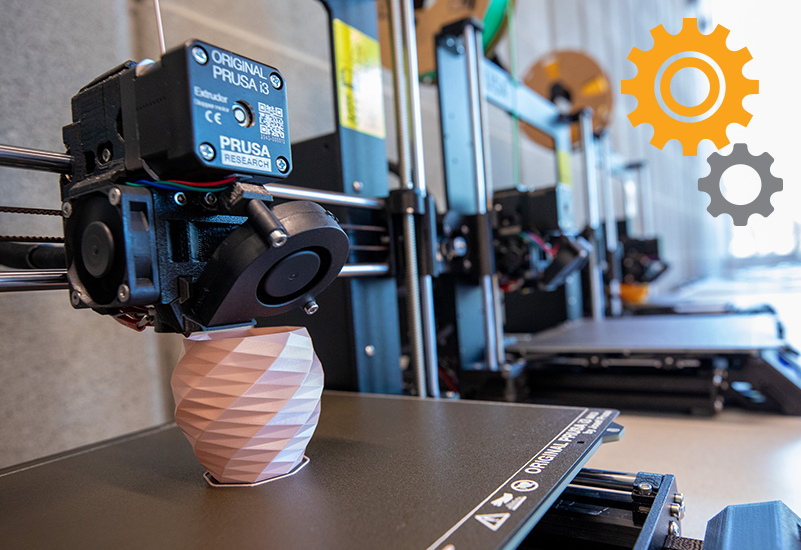 a pink geometric vase being printed using an original Prusa i3 3D printer